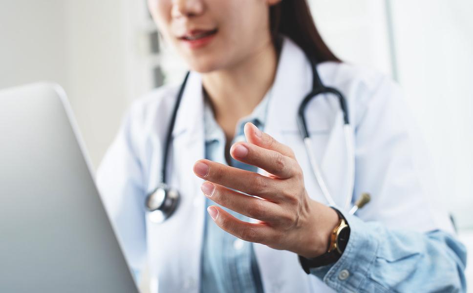 doctor giving telehealth vaccine information